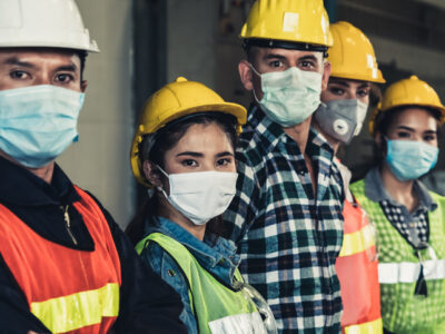 Factory workers with face mask protect from outbreak of Corona Virus Disease 2019 or COVID-19.